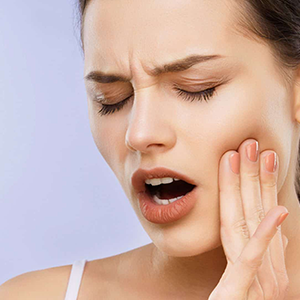 Incomplete tooth eruption causes swelling and pain by pushing against nearby teeth