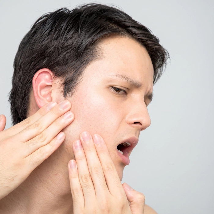 Best TMJ jaw disorder specialist examining patient at Sri Sakthi Dental Clinic Coimbatore